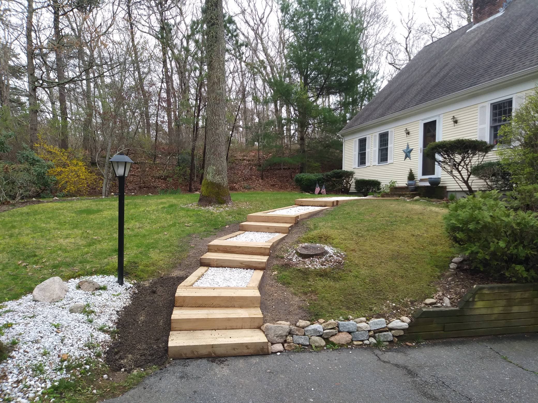 Project Front Yard Transformation with Wooden Steps and Gravel Path image