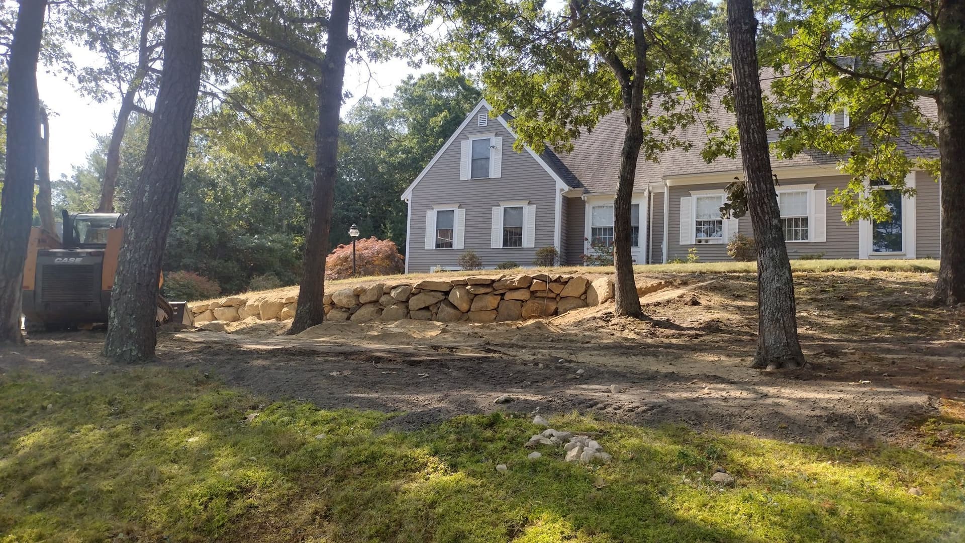 Crafting Beauty with Boulder Walls in Yard