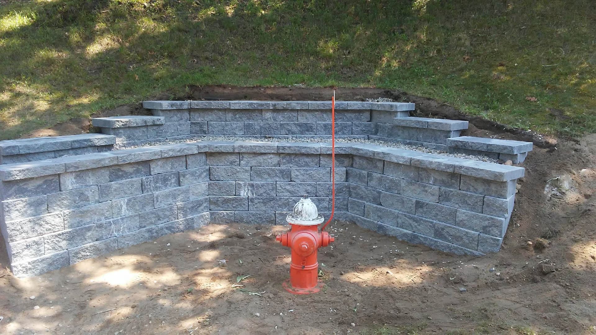 Stunning Stone Retaining Wall Enhances Landscape image