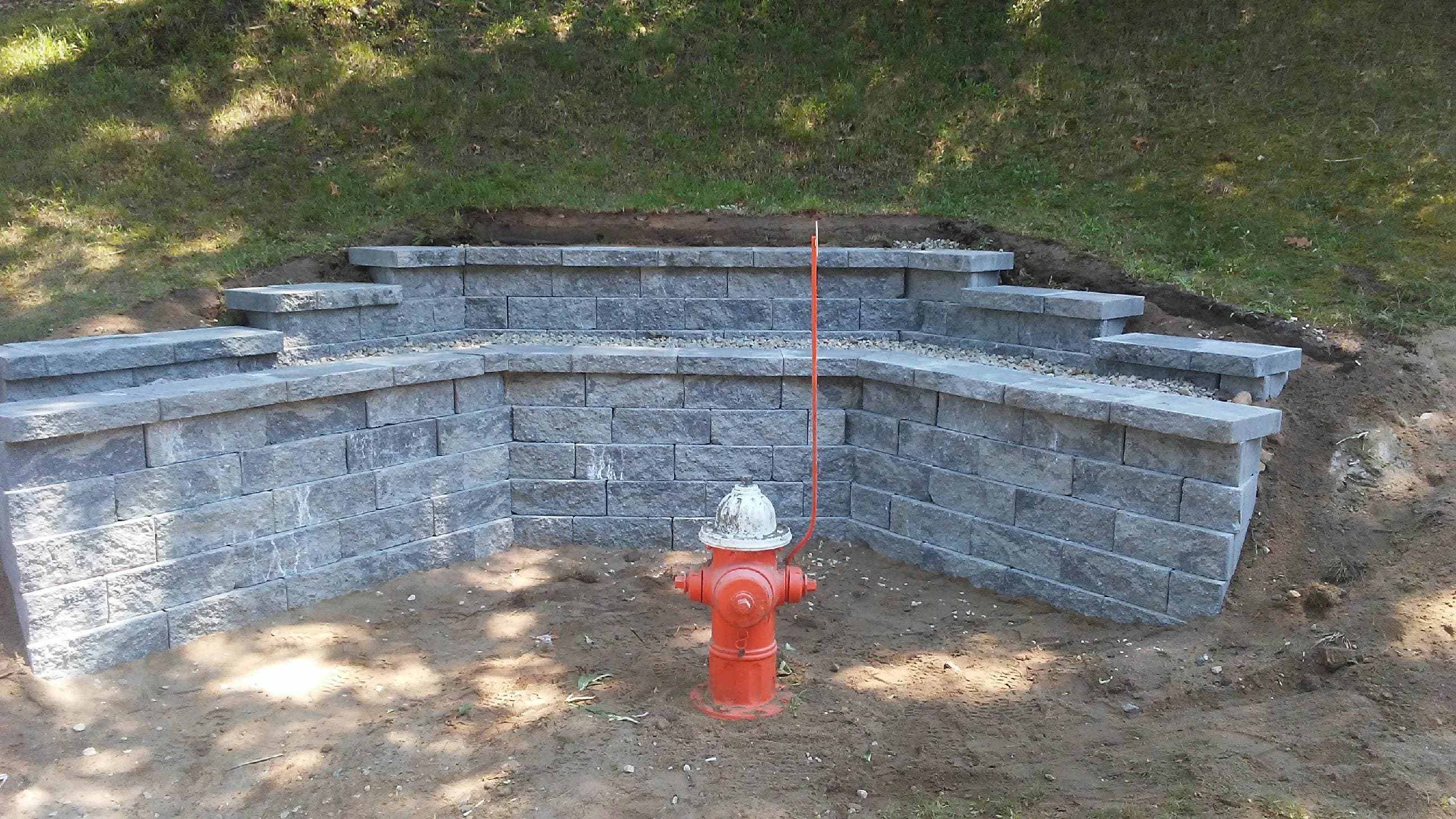 Project Stunning Stone Retaining Wall Enhances Landscape image